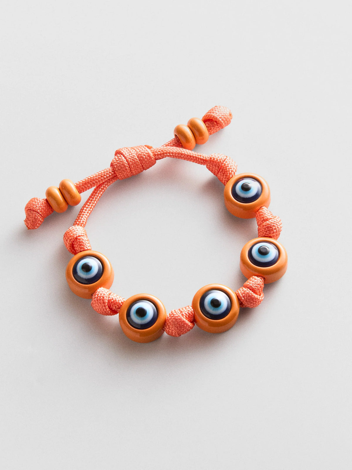 KNOTTY GOOD EYE CORD BRACELET  TANGERINE