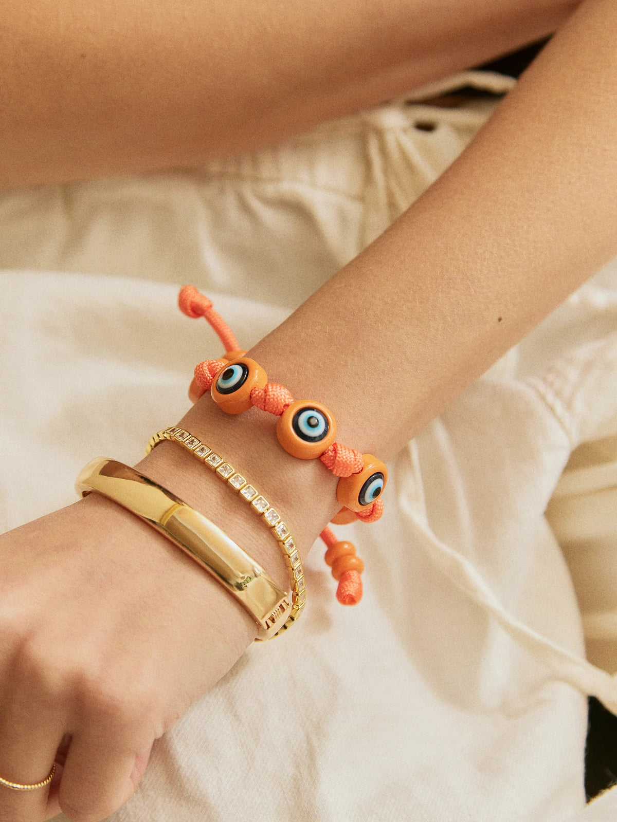 KNOTTY GOOD EYE CORD BRACELET  TANGERINE