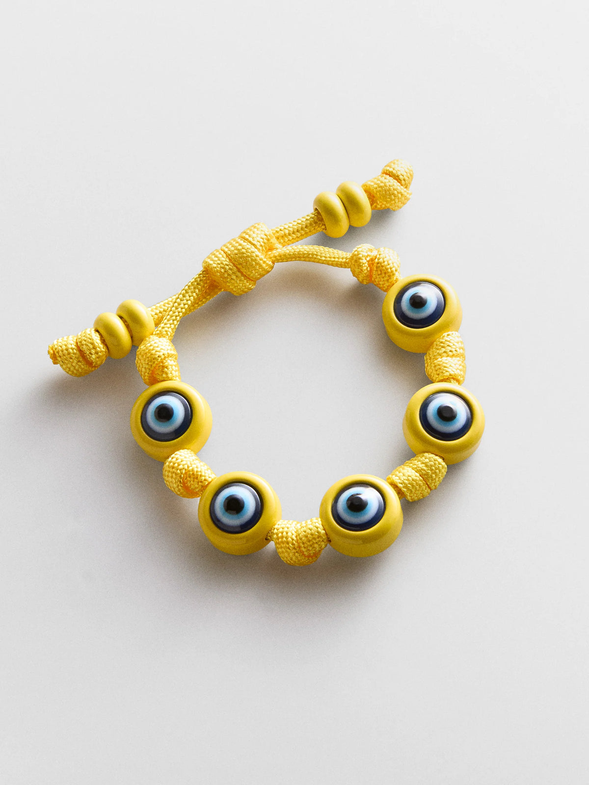 KNOTTY GOOD EYE CORD BRACELET  YELLOW