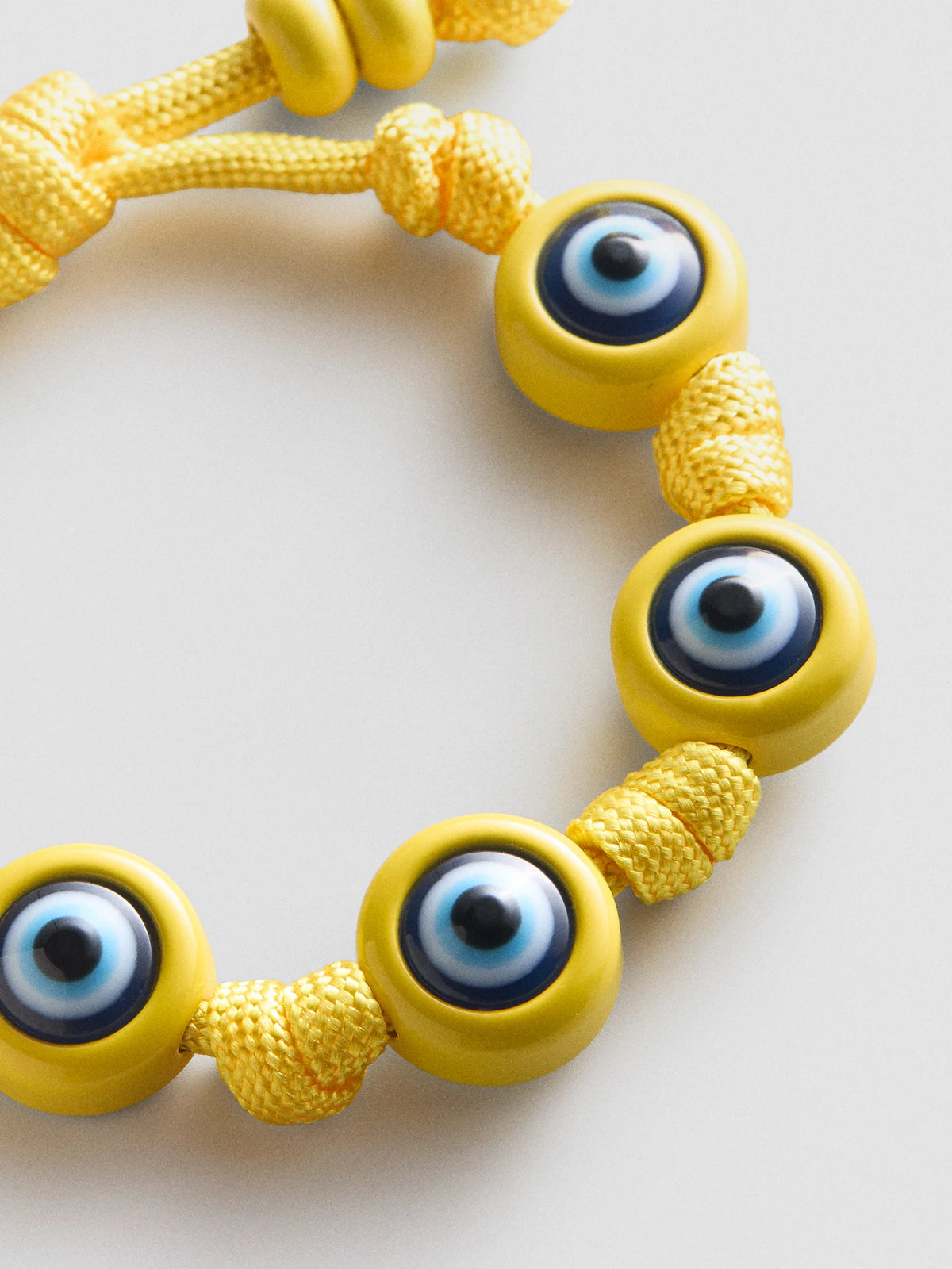 KNOTTY GOOD EYE CORD BRACELET  YELLOW