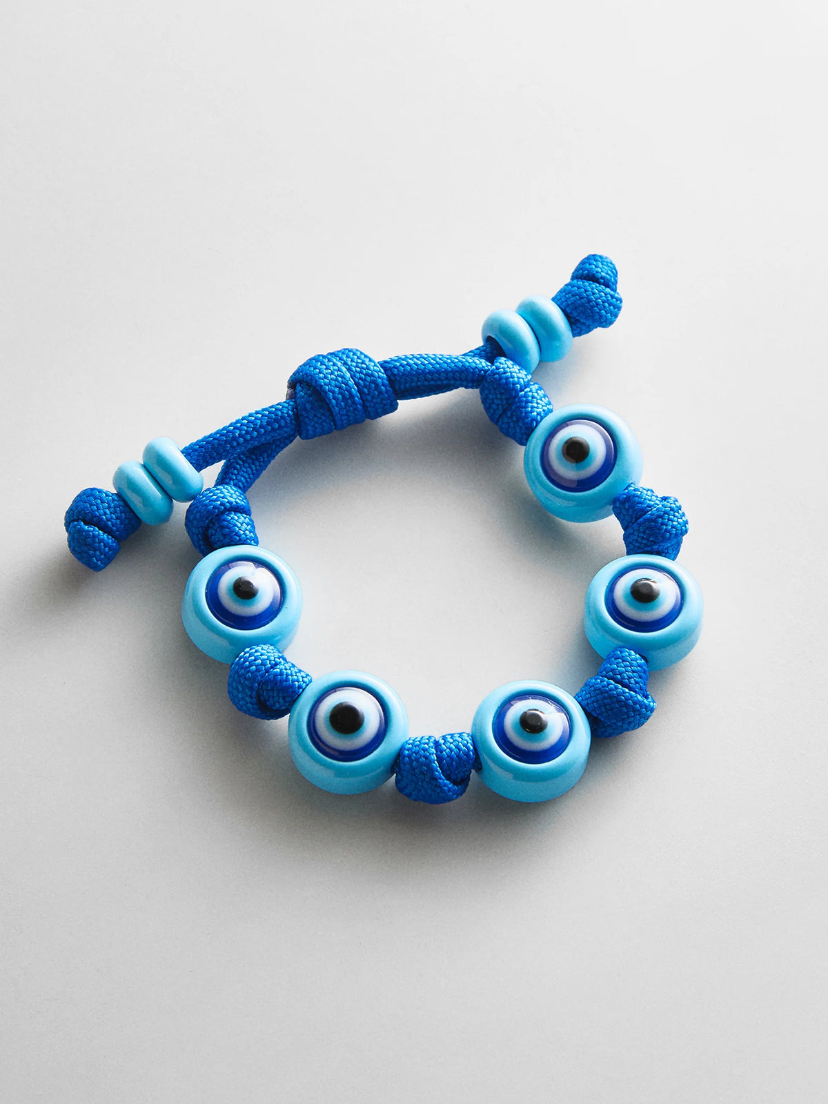 KNOTTY GOOD EYE CORD BRACELET  AQUA